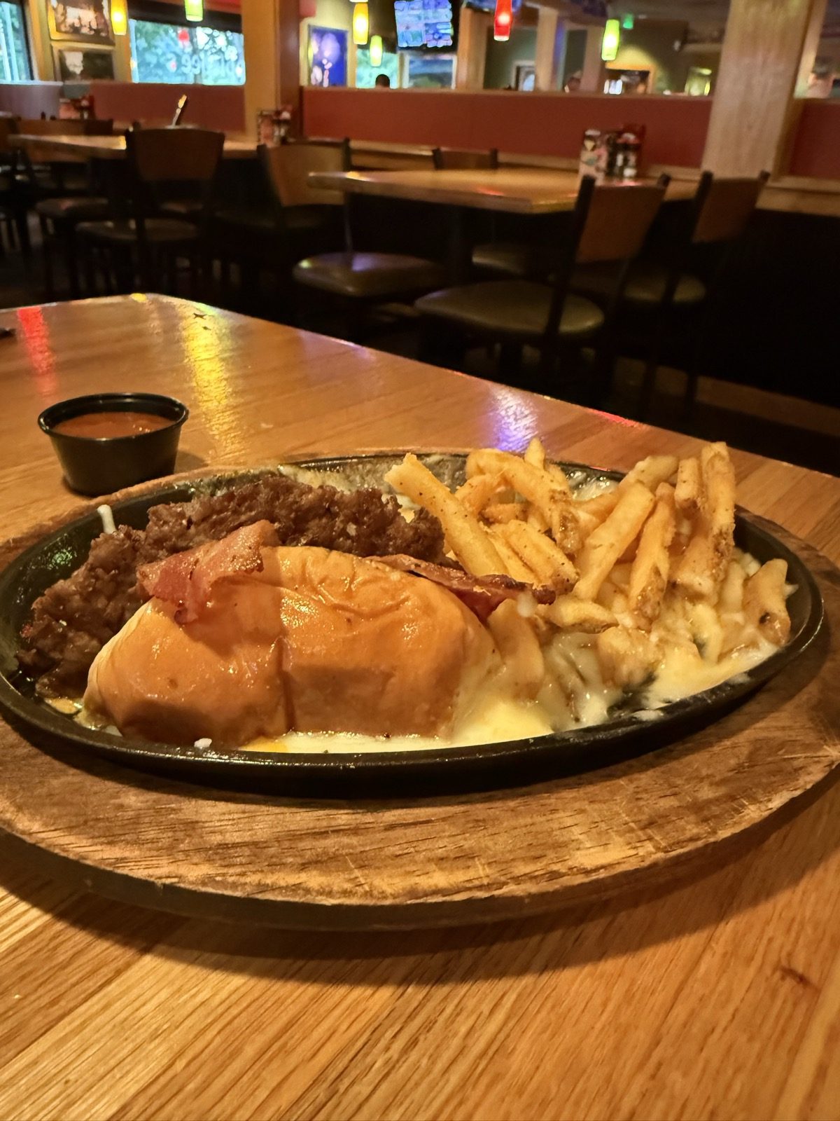Off the skillet and onto the table, still sizzling. $16.49 on its own, 1,500 calories before the fries.