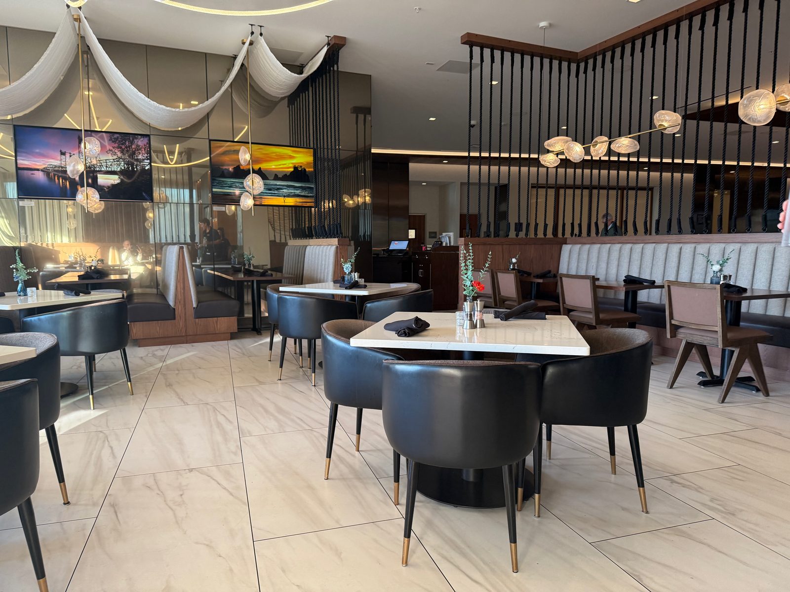 Before the room filled in — clean, modern, a little hotel-lobby-adjacent in the best way, since that's exactly what it is.