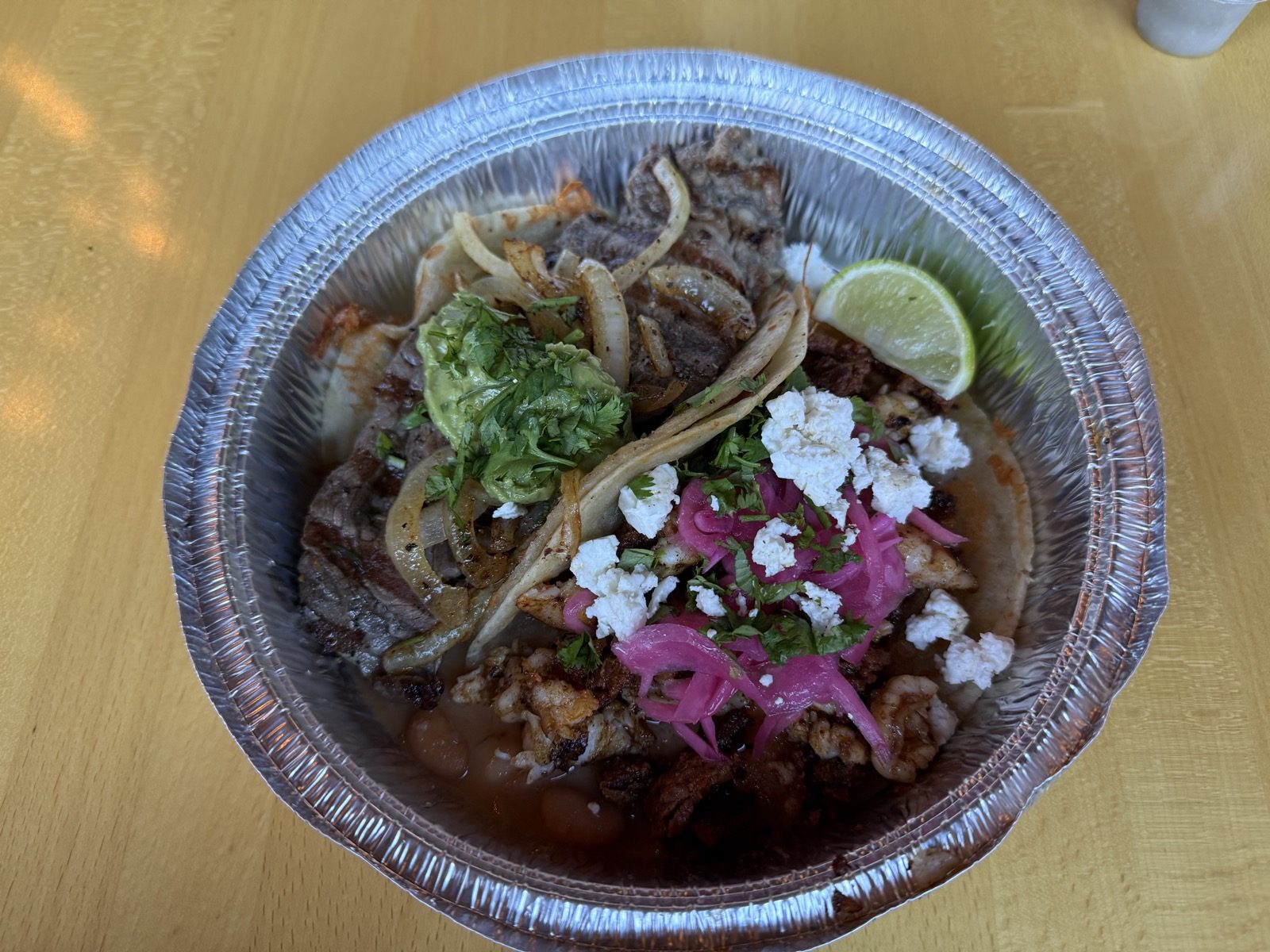 The Tacos Fita plate from the same visit. Carne asada, pickled onion, cotija — the same combination that made the earlier write-up a five.