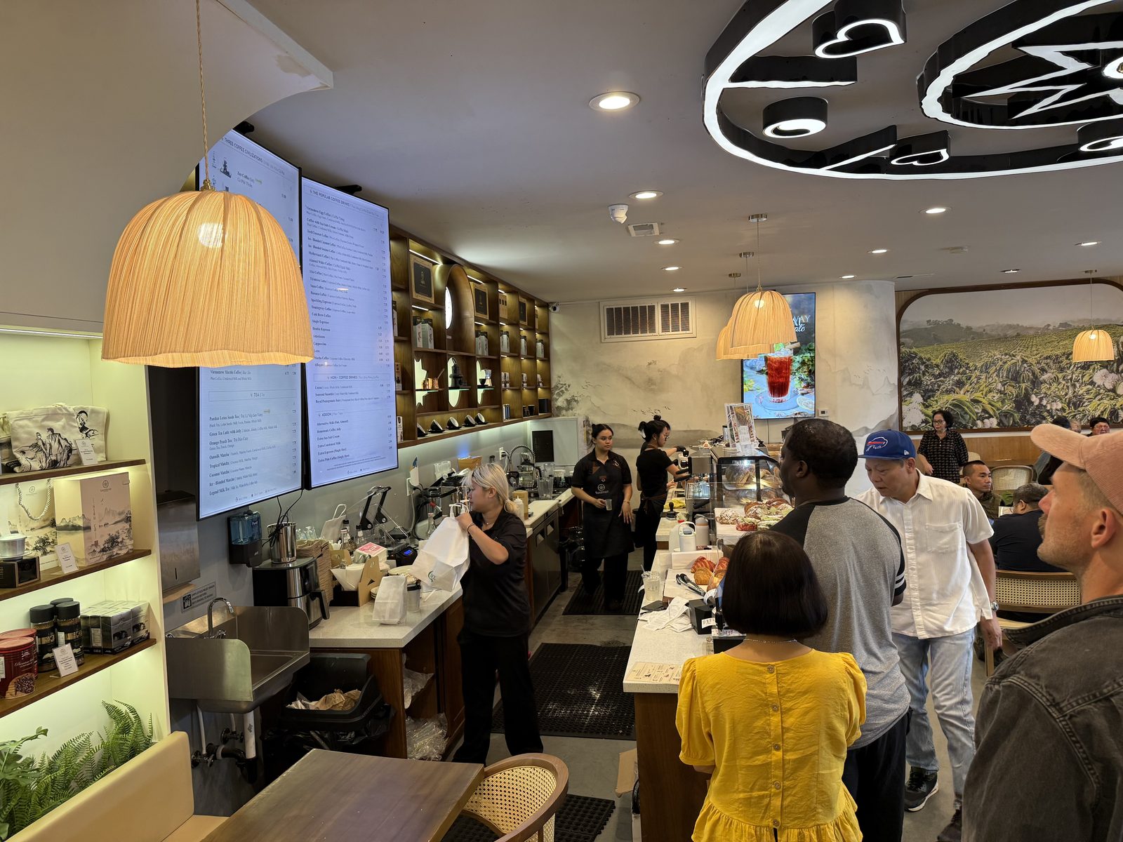 The counter — digital menus overhead, a line the whole time we were there.
