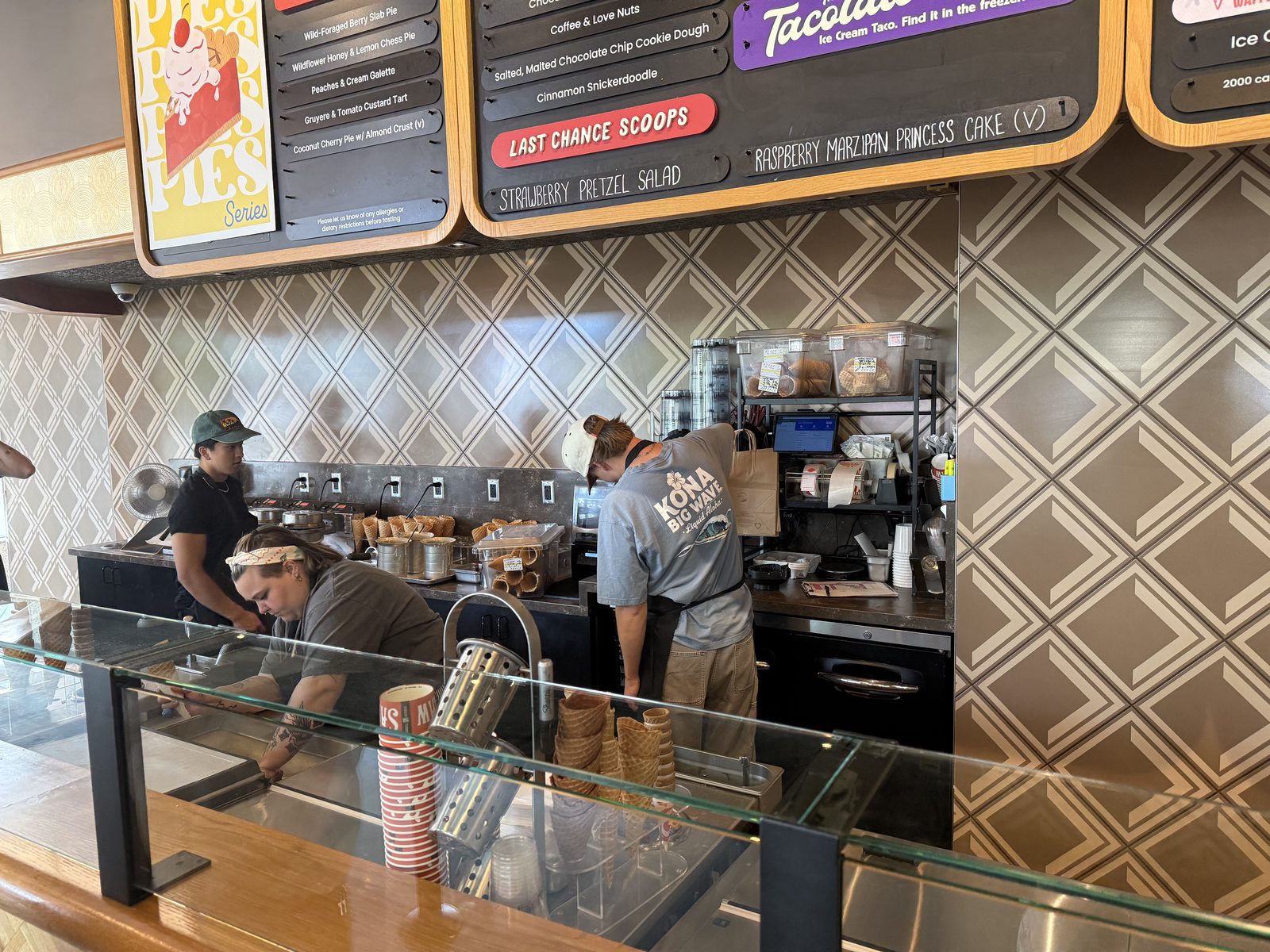 The counter, mid-scoop. The board above lists this season's specials.