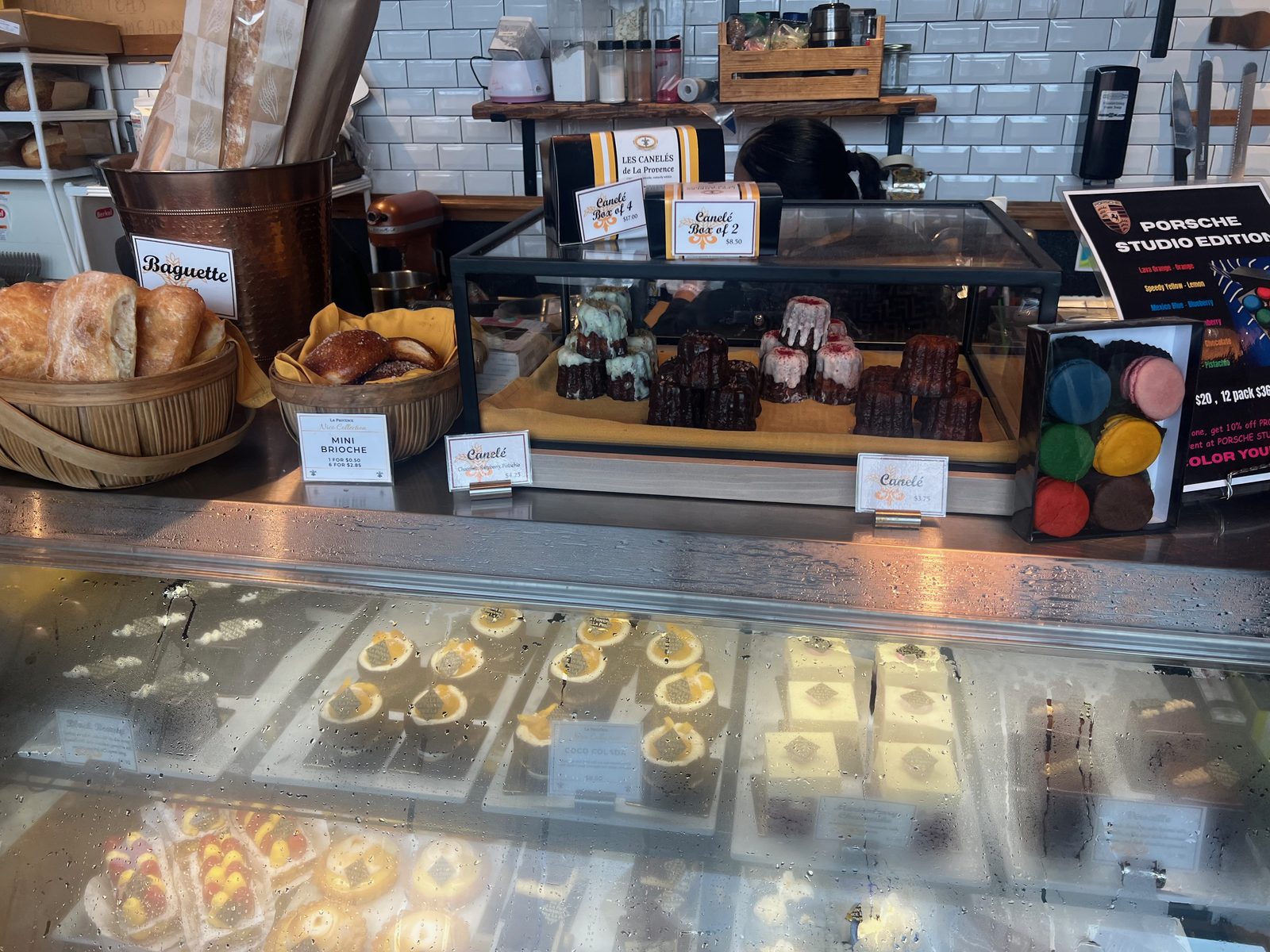 Les Canelés de La Provence, plus baguettes, mini brioche, and — genuinely — a Porsche Studio Edition macaron collaboration.