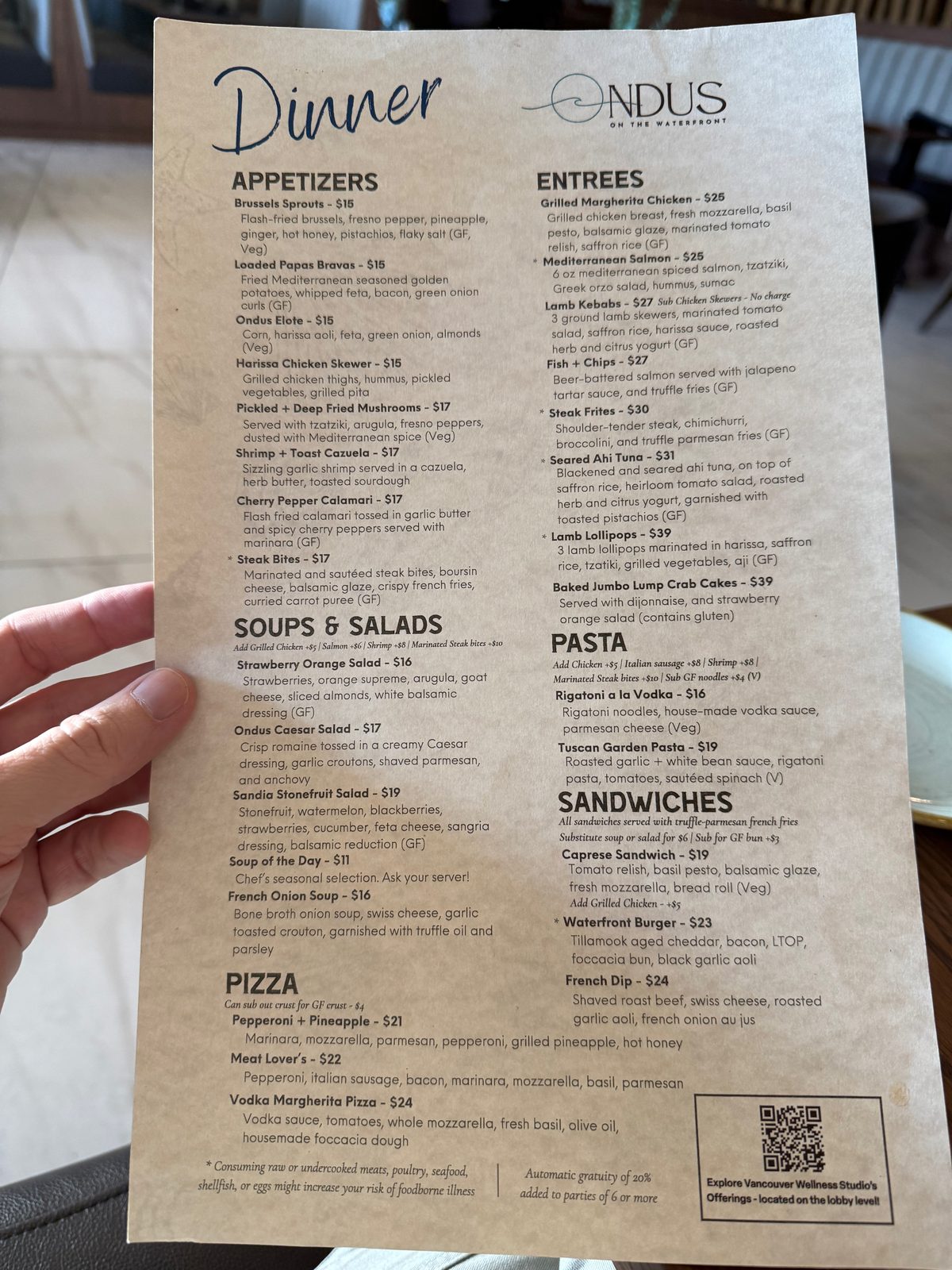 Appetizers on the left, entrees and sandwiches on the right — worth reading slowly, because almost everything on it sounded good.