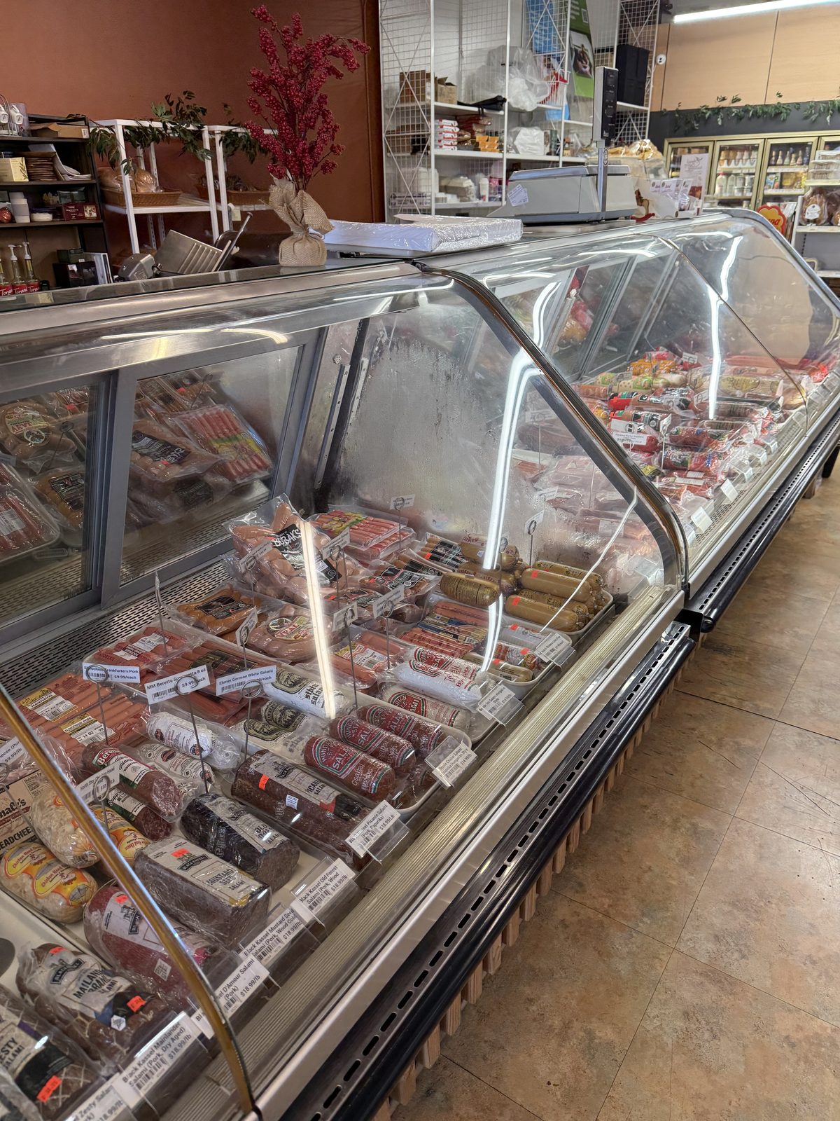 The deli case runs most of one wall.