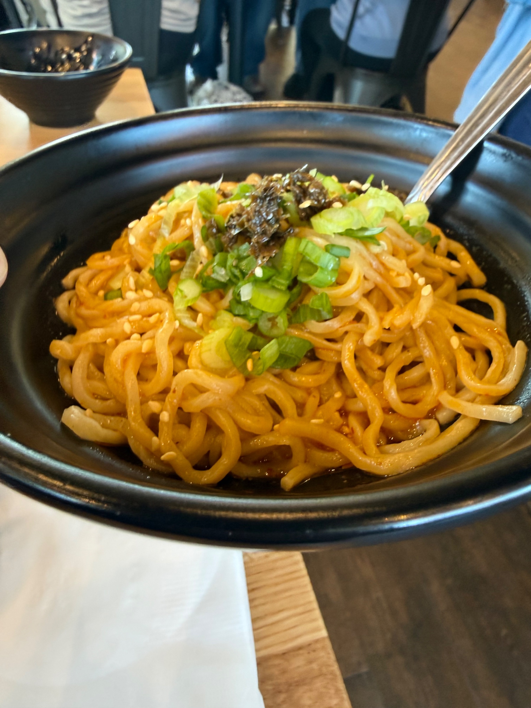 What makes the Dan Dan noodles at the Dough Zone so yummy and distinct?