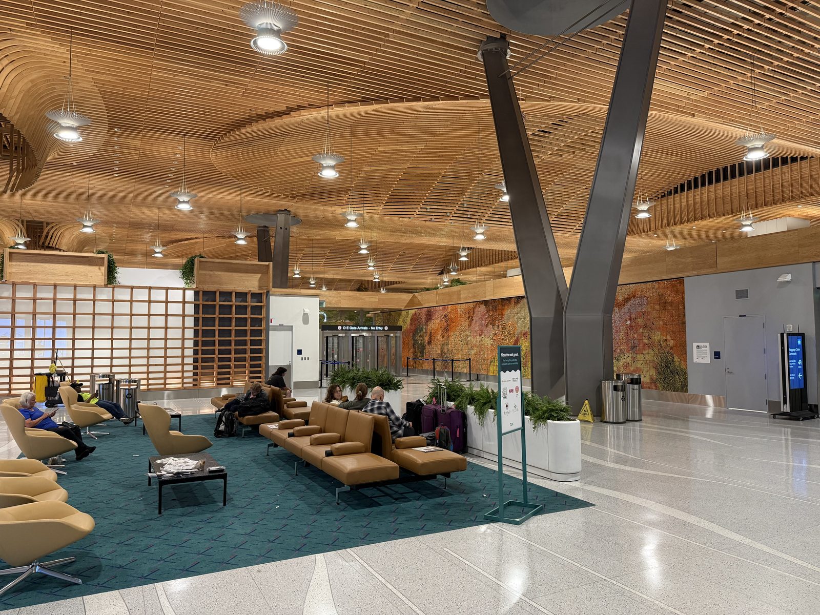 Baggage claim, not a departure lounge — you don't need a boarding pass to see this part.