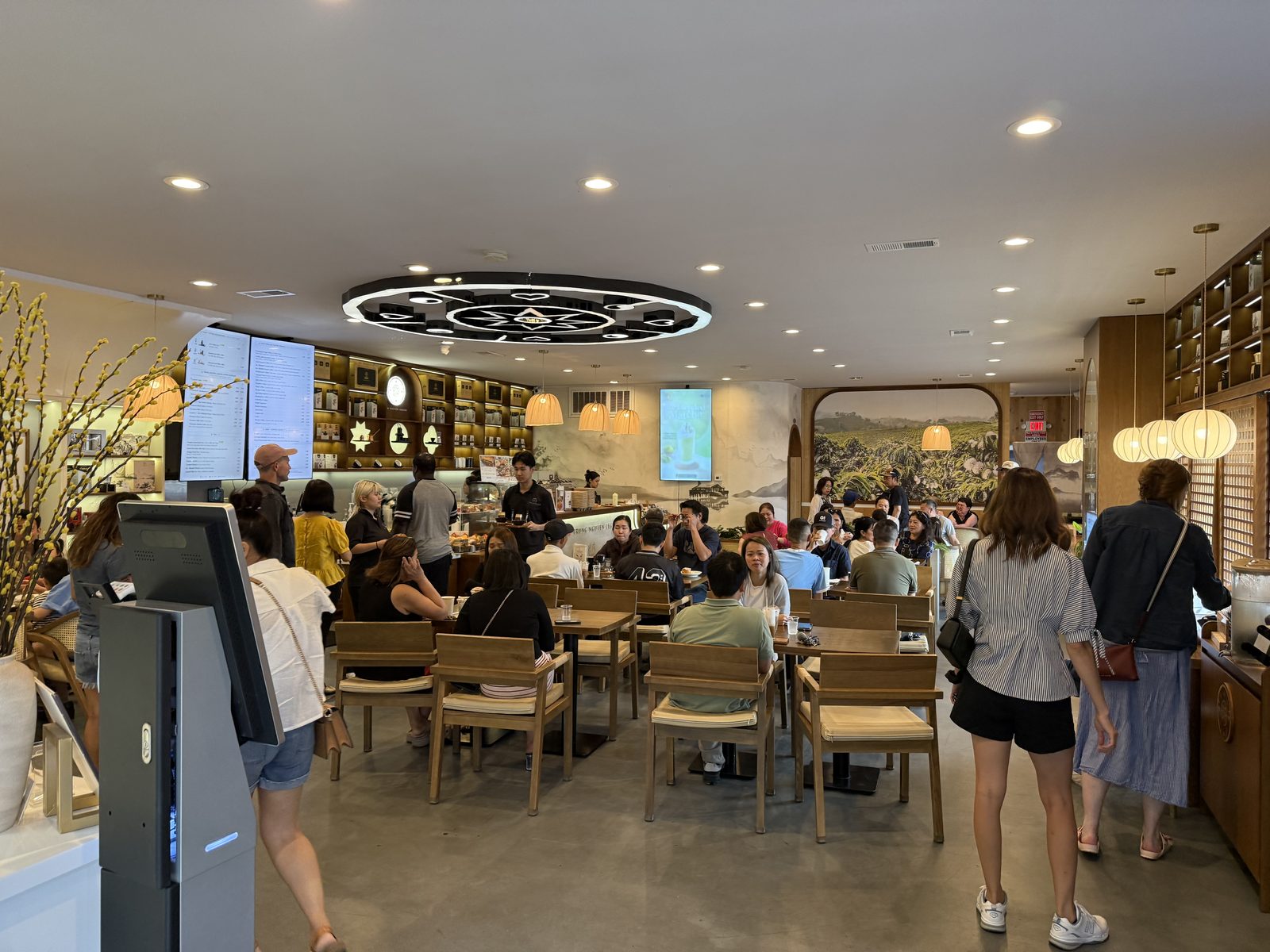 Sunday, mid-morning. Every table taken, a line still at the register.
