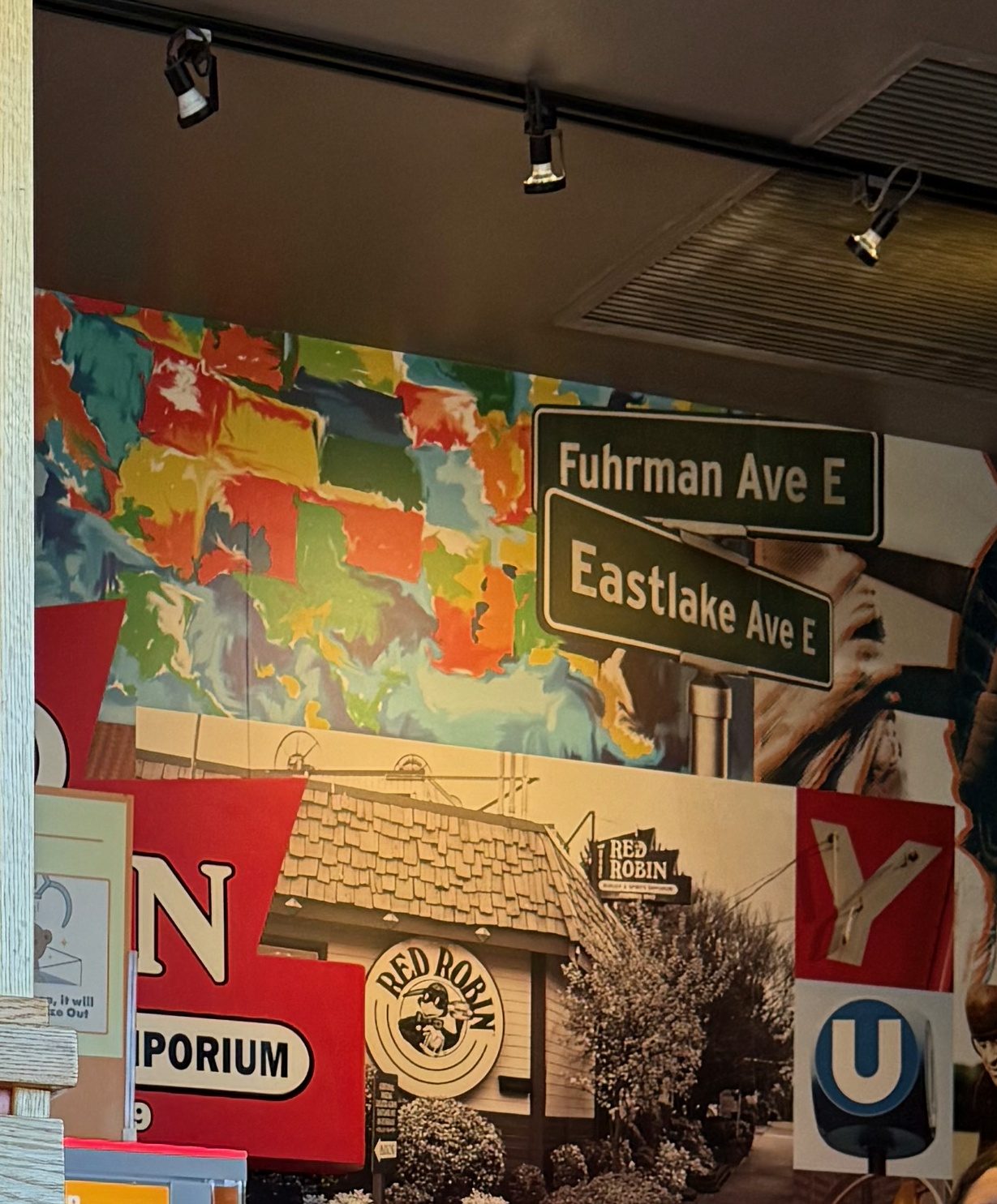 Fuhrman and Eastlake. Underneath, the building itself — Burger & Spirits Emporium, and the old bird in the circle.