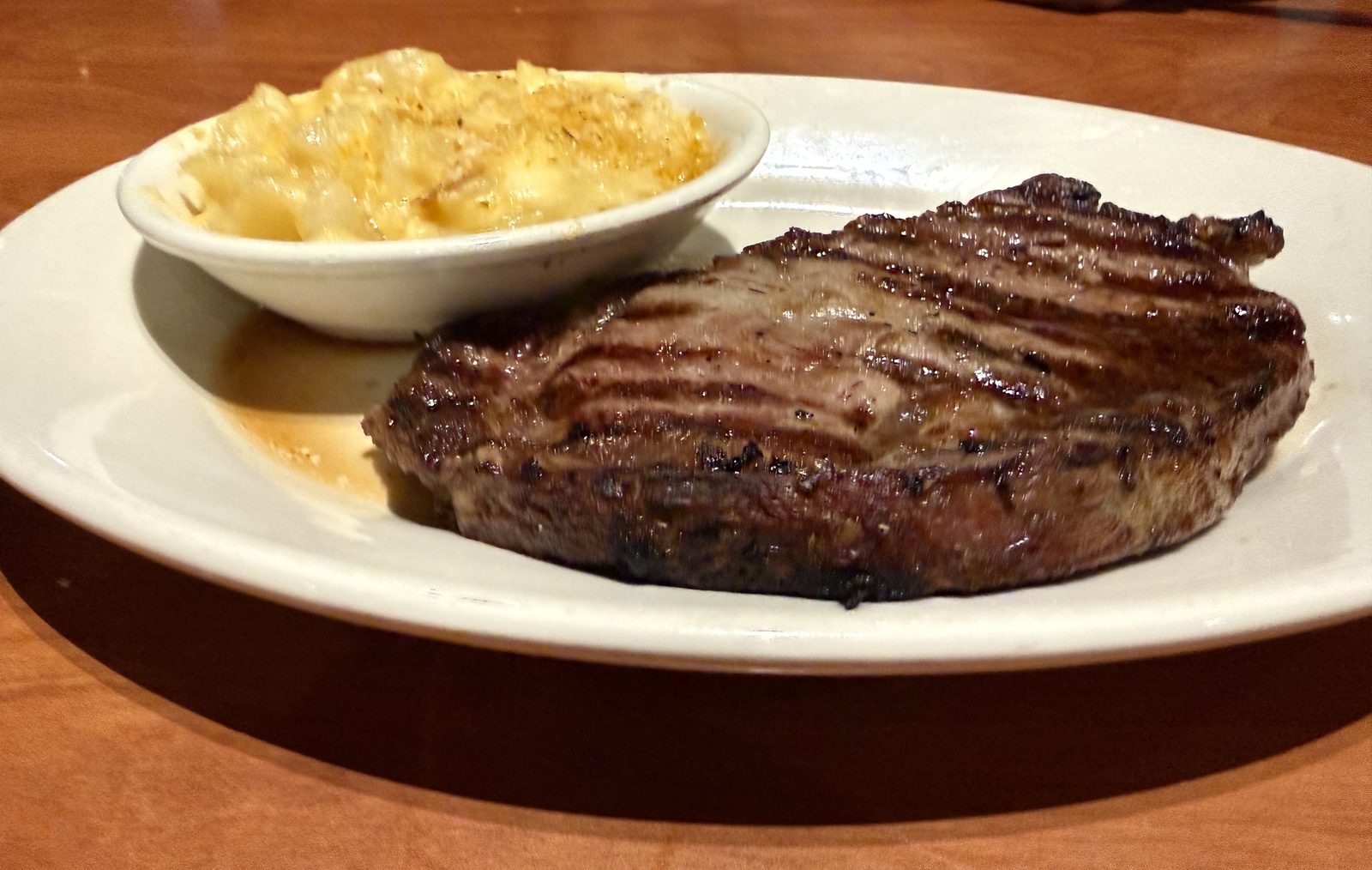And the New York strip, from further down the table. The better of the two plates.