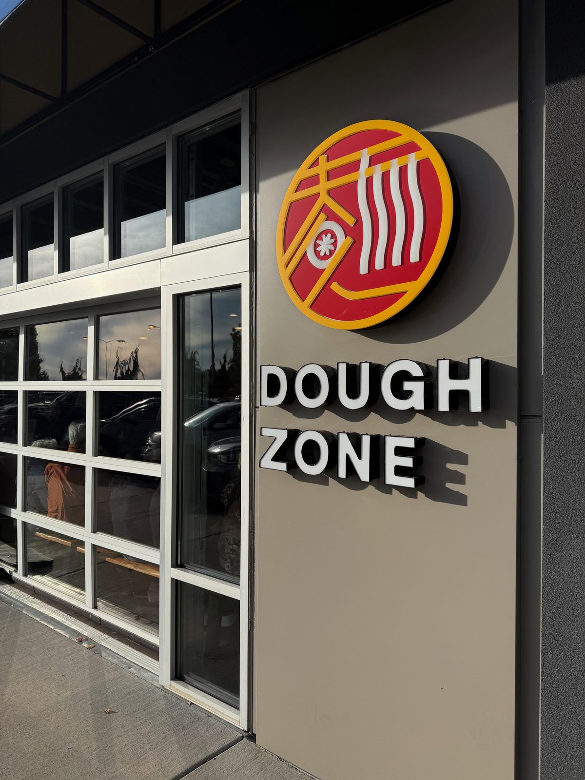 The sign out front — a bowl of noodles worked right into the logo.