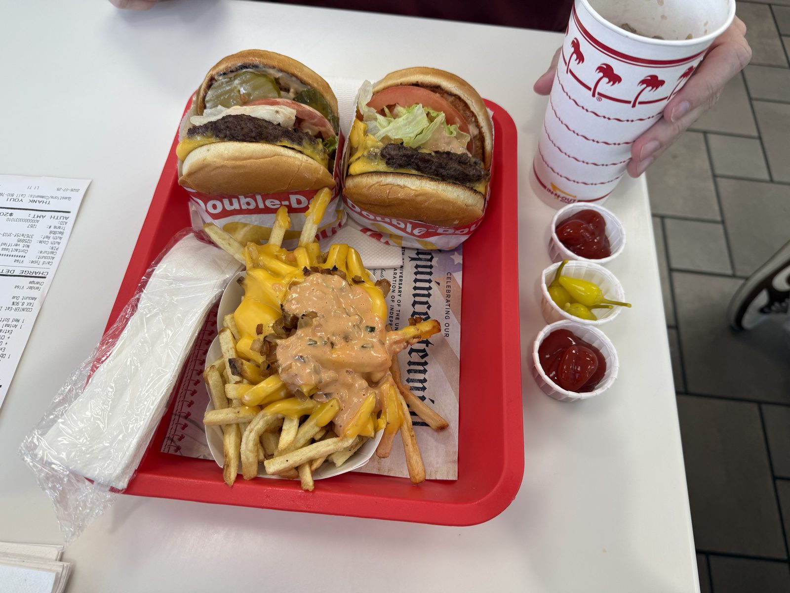 The whole order, before either of us touched it. The peppers in the third cup are doing more work than they look like they are.