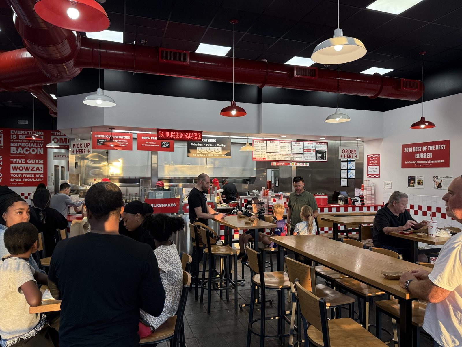 Every table full, more people standing than sitting, and a kitchen working through a backlog it didn't have the ingredients to keep up with.