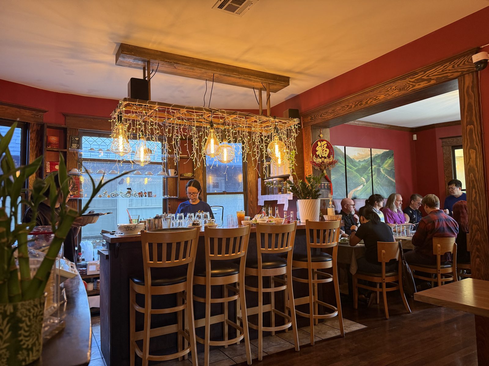 The bar, and the rice-terrace mural behind it.