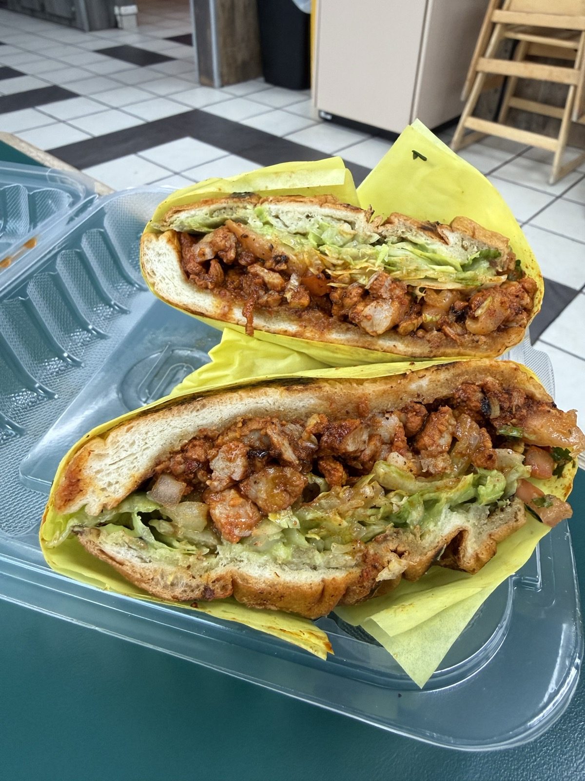 The torta, halved. Tortas are $10.89–$11.59.